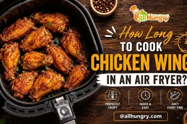 Crispy chicken wings cooking in an air fryer with golden brown texture